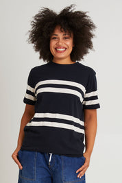 Model Olivia wearing size 10 of the Allegra Ss Tee in colour Navywhite (Blue), from the front, cropped image
