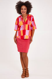 Model Olivia wearing size 10 of the Soleil Check Top in colour Solcheck, from the front, showing the whole outfit