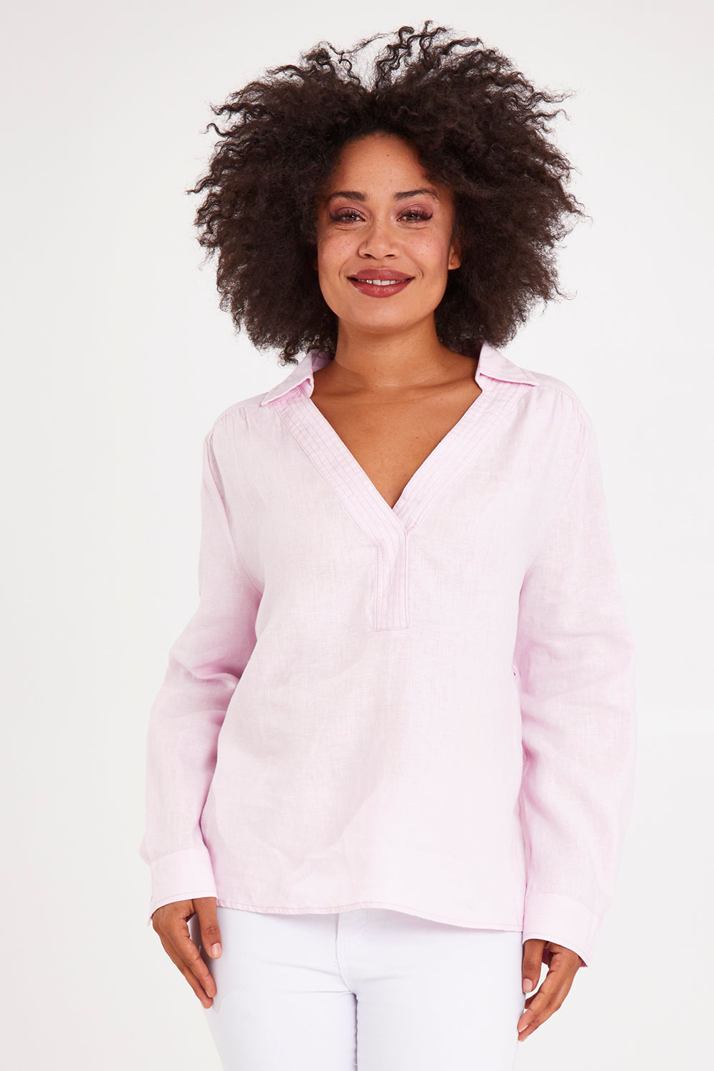 Model Olivia wearing size 10 of the Blair Open Neck Shirt in colour Blossom (Pink), from the front, cropped image
