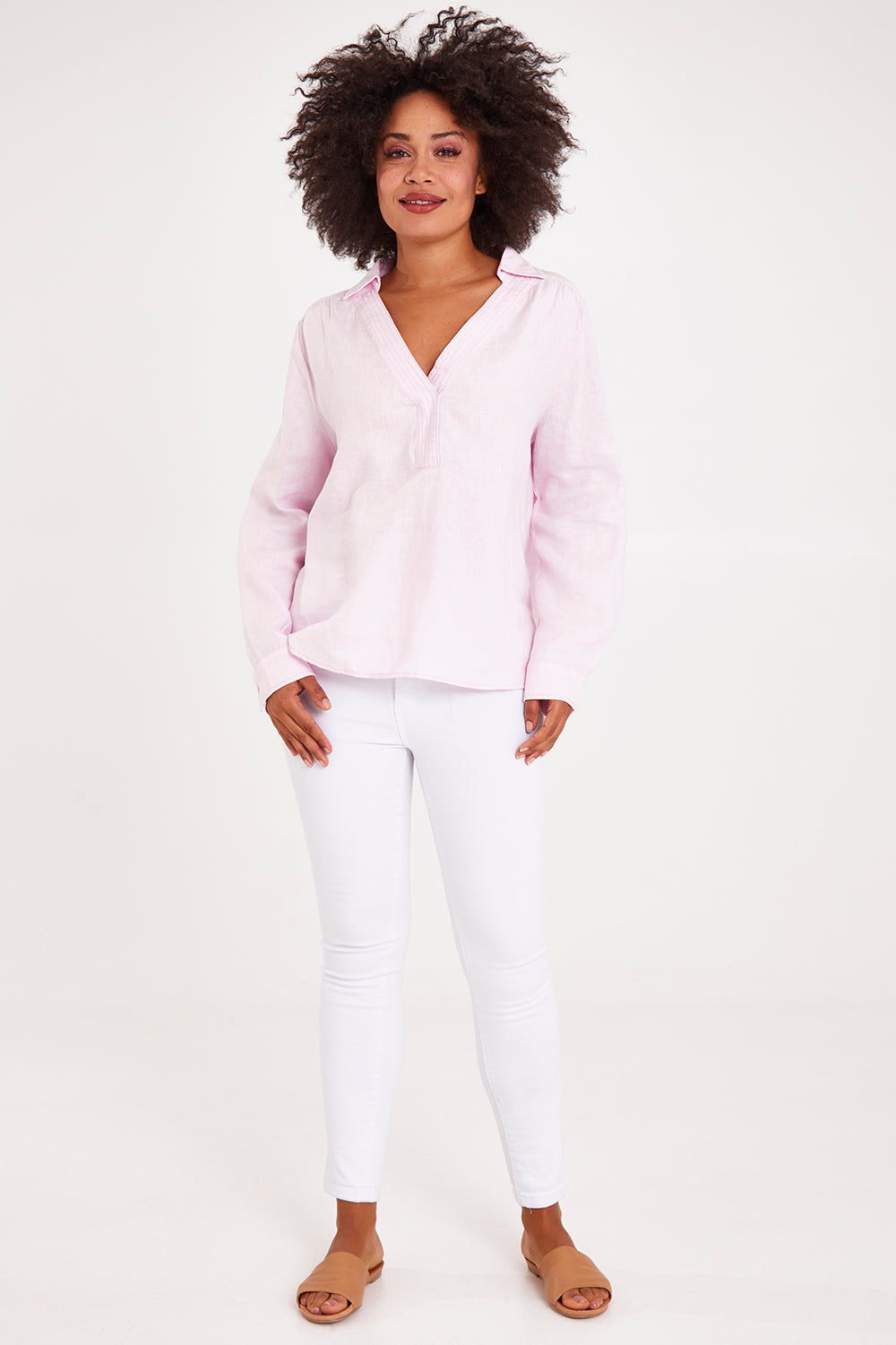 Model Olivia wearing size 10 of the Blair Open Neck Shirt in colour Blossom (Pink), from the front, showing the whole outfit