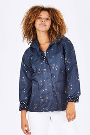 Model Summer wearing size 10 of the Rain Drops Jacket in colour NavyRoseG (Blue), from the front, cropped image