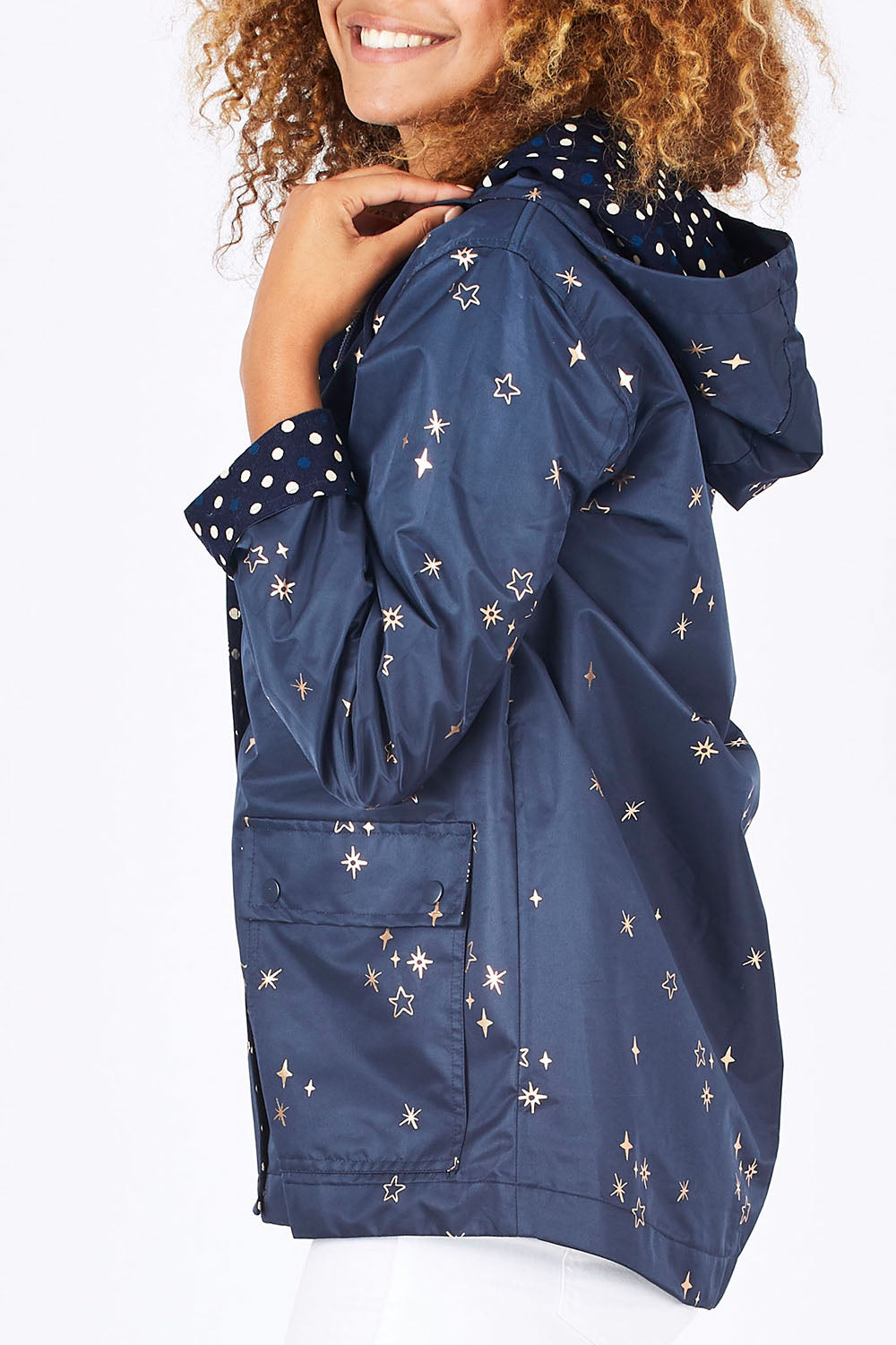 Model Summer wearing size 10 of the Rain Drops Jacket in colour NavyRoseG (Blue), from the front, cropped image