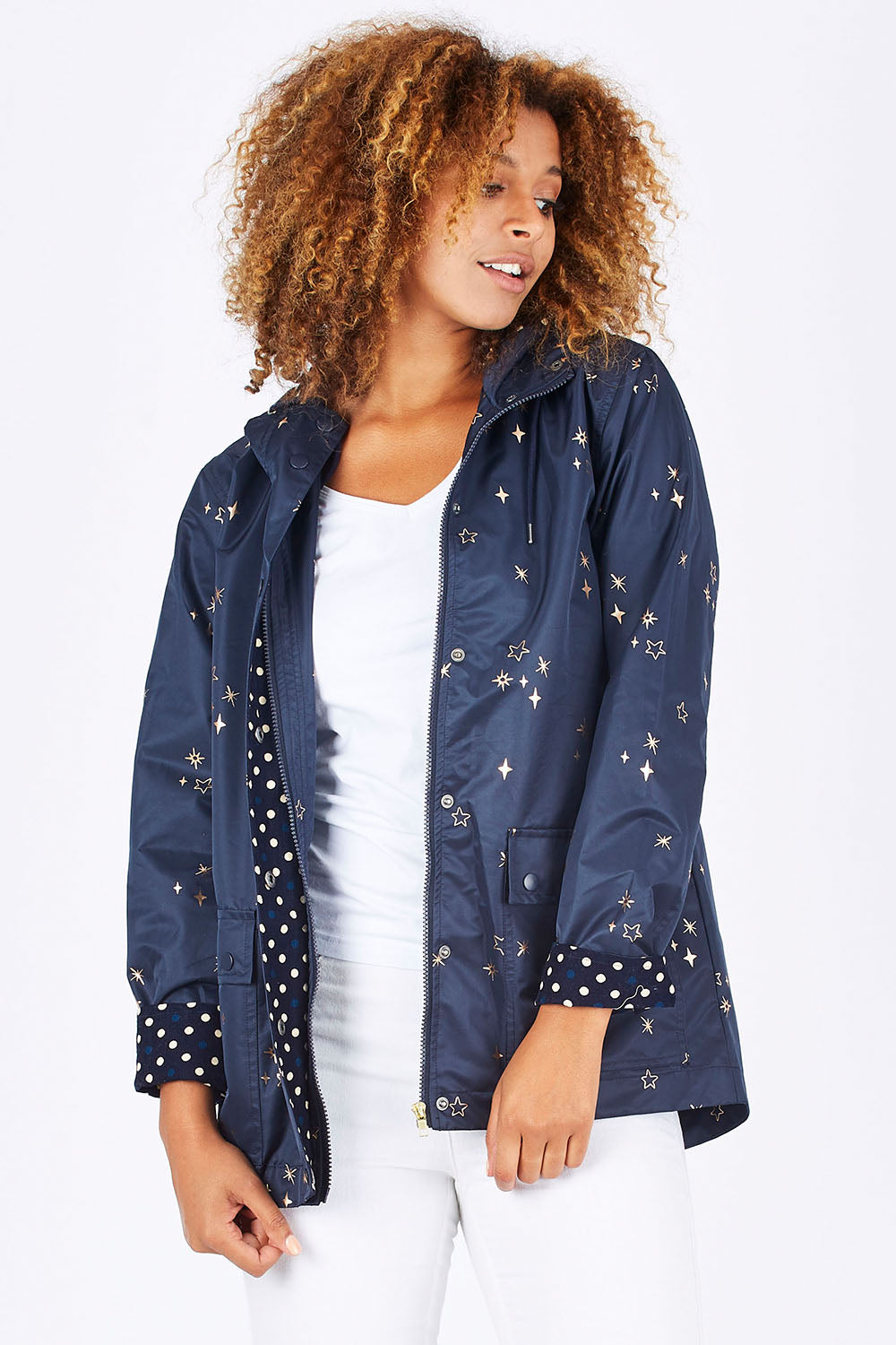 Model Summer wearing size 10 of the Rain Drops Jacket in colour NavyRoseG (Blue), from the front, cropped image