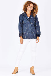 Model Summer wearing size 10 of the Rain Drops Jacket in colour NavyRoseG (Blue), from the front, showing the whole outfit