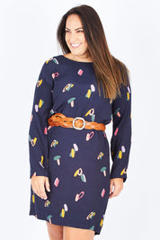 Model Stacey wearing size 12 of the Falling Sherbet Dress in colour Navy (Blue), from the front, cropped image
