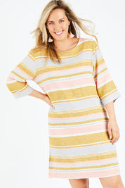 Model Jess wearing size 14 of the Juniper Stripe Dress in colour Multistrip (Pink), from the front, cropped image