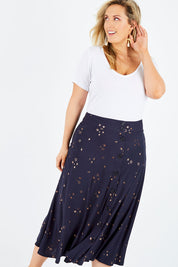 Model Jess wearing size 14 of the Celestial Skirt in colour Navy (Blue), from the front, cropped image