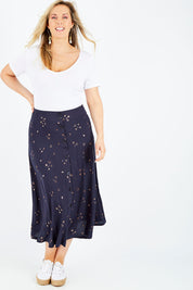 Model Jess wearing size 14 of the Celestial Skirt in colour Navy (Blue), from the front, showing the whole outfit