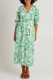Model Olivia wearing size 10 of the Florentina Cotton Dress in colour Florentina (Green), from the front, cropped image