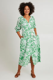 Model Olivia wearing size 10 of the Florentina Cotton Dress in colour Florentina (Green), from the front, showing the whole outfit