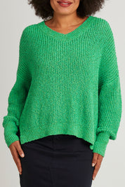Model Olivia wearing size S of the Rachele V Neck Knit in colour Greenbriar (Green), from the front, cropped image