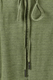 Product shot of the Mila Utility Skirt in colour Clover (Green), detail