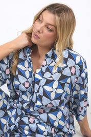 A model wearing the Painted Tile Linen Blend Shirt in colour Geoprint (Blue), from the front, cropped image