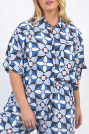 A model wearing the Painted Tile Linen Blend Shirt in colour Geoprint (Blue), from the front, cropped image
