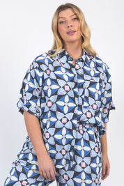 A model wearing the Painted Tile Linen Blend Shirt in colour Geoprint (Blue), from the front, cropped image