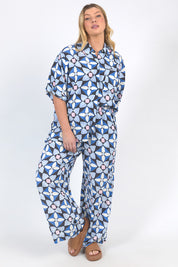 A model wearing the Painted Tile Linen Blend Shirt in colour Geoprint (Blue), from the front, showing the whole outfit