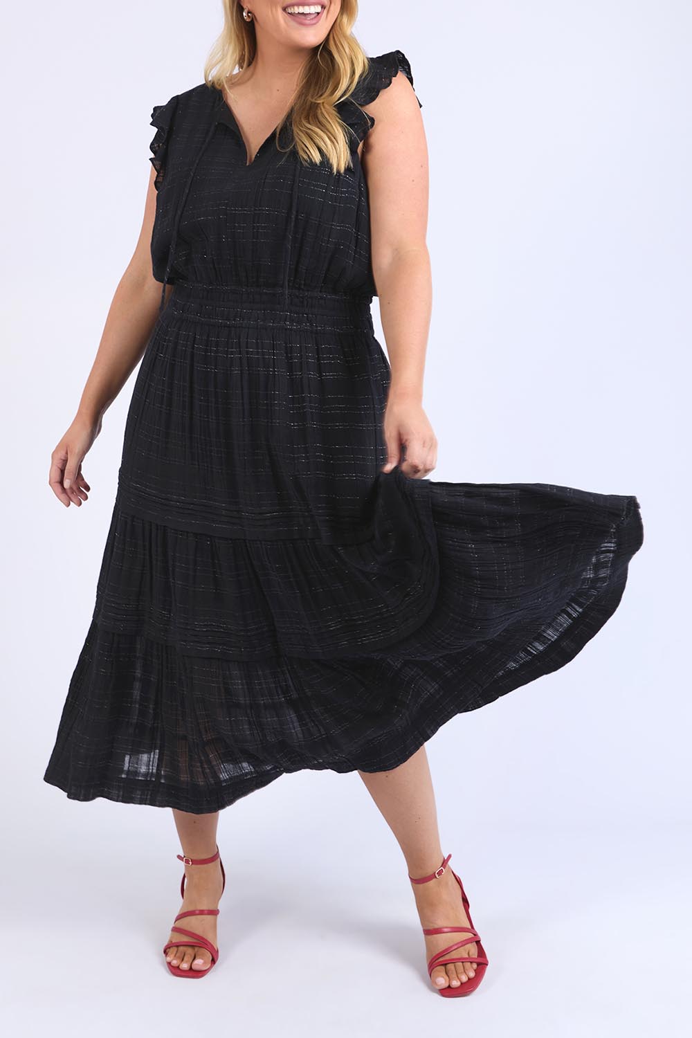 A model wearing the Isabella Cotton Blend Dress in colour Black (Black), from the front, cropped image