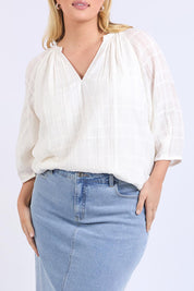 A model wearing the Isabella Cotton Blend Blouse in colour Marshmello, from the front, cropped image