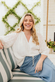 A model wearing the Isabella Cotton Blend Blouse in colour Marshmello, from the front, showing the whole outfit
