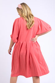 A model wearing the Bliss Relaxed Lyocell Linen Dress in colour Watermelon (Pink), from the back