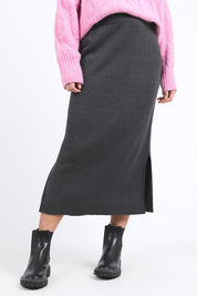 A model wearing the Elodie Cotton Blend Knit Skirt in colour Charcoal (Grey), from the front, cropped image