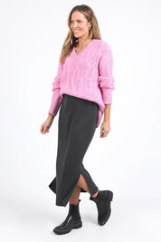 A model wearing the Elodie Cotton Blend Knit Skirt in colour Charcoal (Grey), from the front, showing the whole outfit