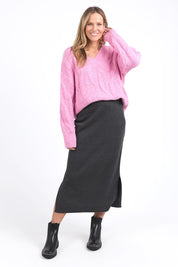 A model wearing the Elodie Cotton Blend Knit Skirt in colour Charcoal (Grey), from the front, showing the whole outfit