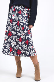 A model wearing the Indie Floral Lyocell Linen Skirt in colour Indieprint, from the front, cropped image