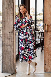 A model wearing the Indie Floral Lyocell Linen Skirt in colour Indieprint, from the front, showing the whole outfit