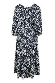 Product shot of the Gemma Geo Dress in colour Navygeo (Blue), from the back
