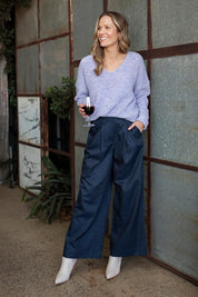 A model wearing the Darcy Tencel Cotton Pant in colour Darksapphi (Blue), from the front, showing the whole outfit