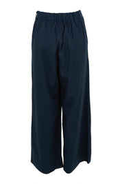Product shot of the Darcy Tencel Cotton Pant in colour Darksapphi (Blue), from the back