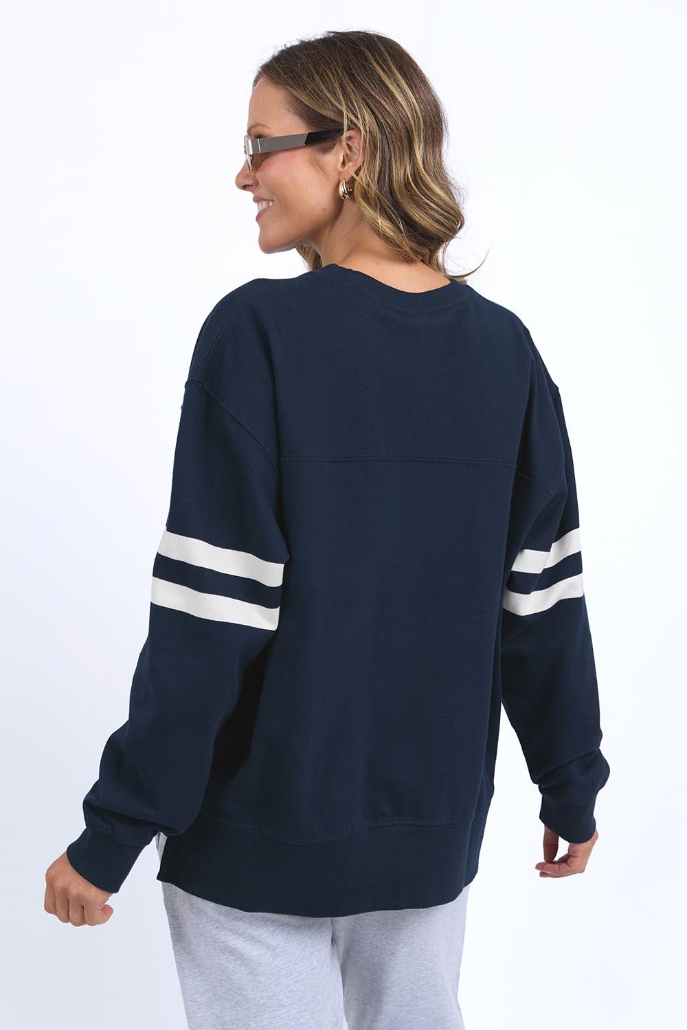 A model wearing the Adora Cotton Blend Crew in colour Drksapphir (Blue), from the back