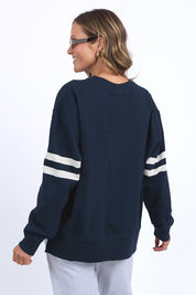 A model wearing the Adora Cotton Blend Crew in colour Drksapphir (Blue), from the back
