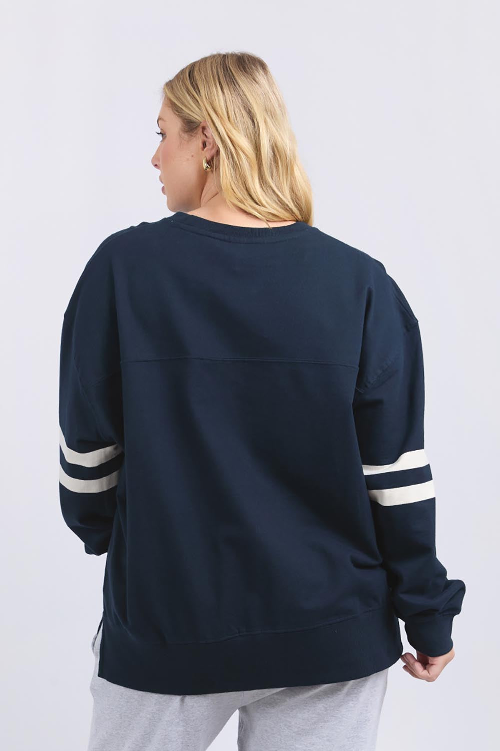 A model wearing the Adora Cotton Blend Crew in colour Drksapphir (Blue), from the back