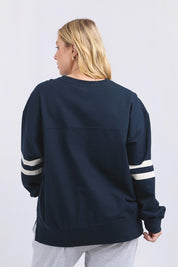 A model wearing the Adora Cotton Blend Crew in colour Drksapphir (Blue), from the back