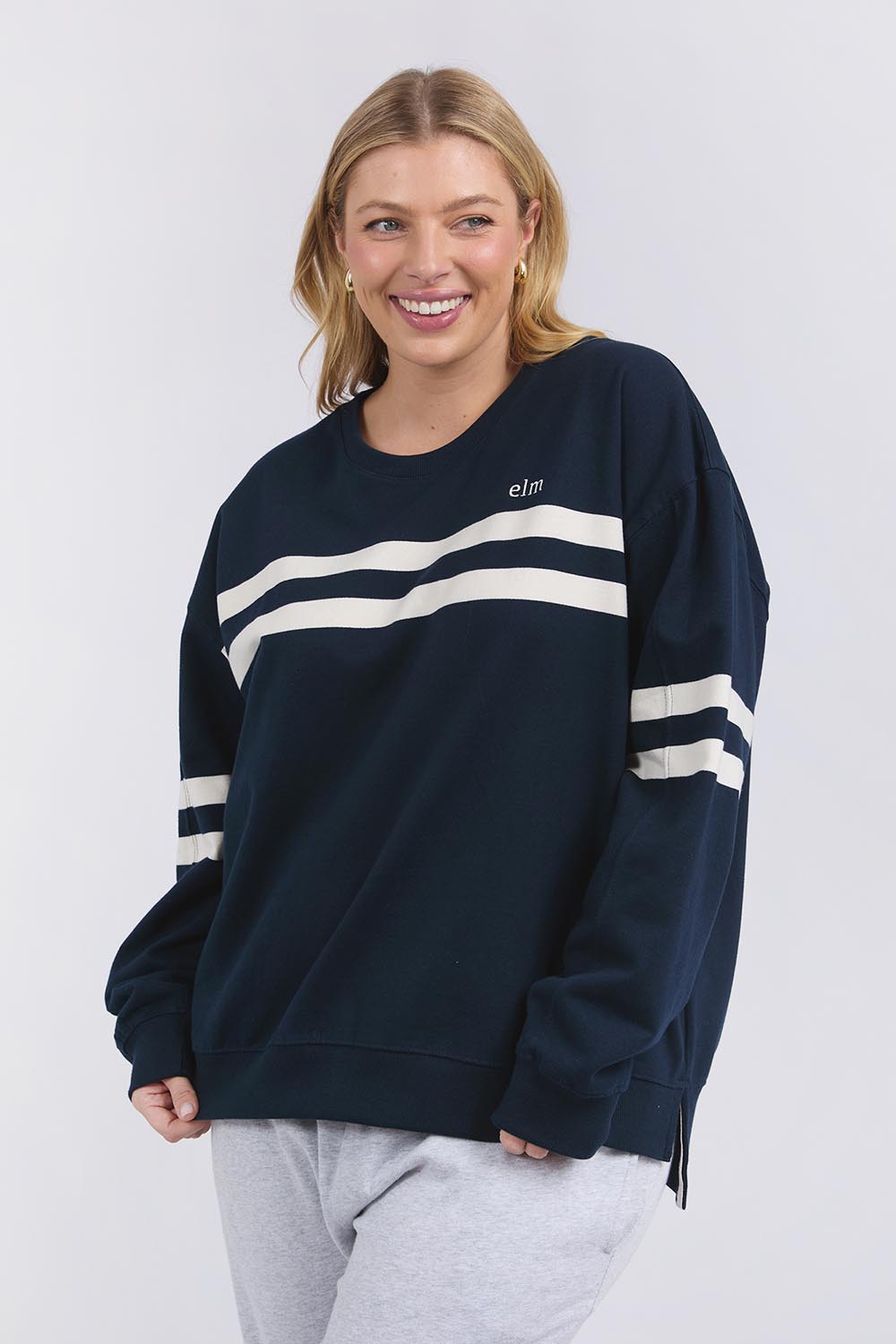 A model wearing the Adora Cotton Blend Crew in colour Drksapphir (Blue), from the front, cropped image