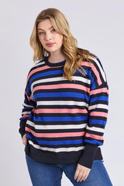 A model wearing the Logan Stripe Knit in colour Navy (Blue), from the front, cropped image