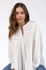 A model wearing the Montana Cotton Blouse in colour Marshmello (White), from the front, cropped image