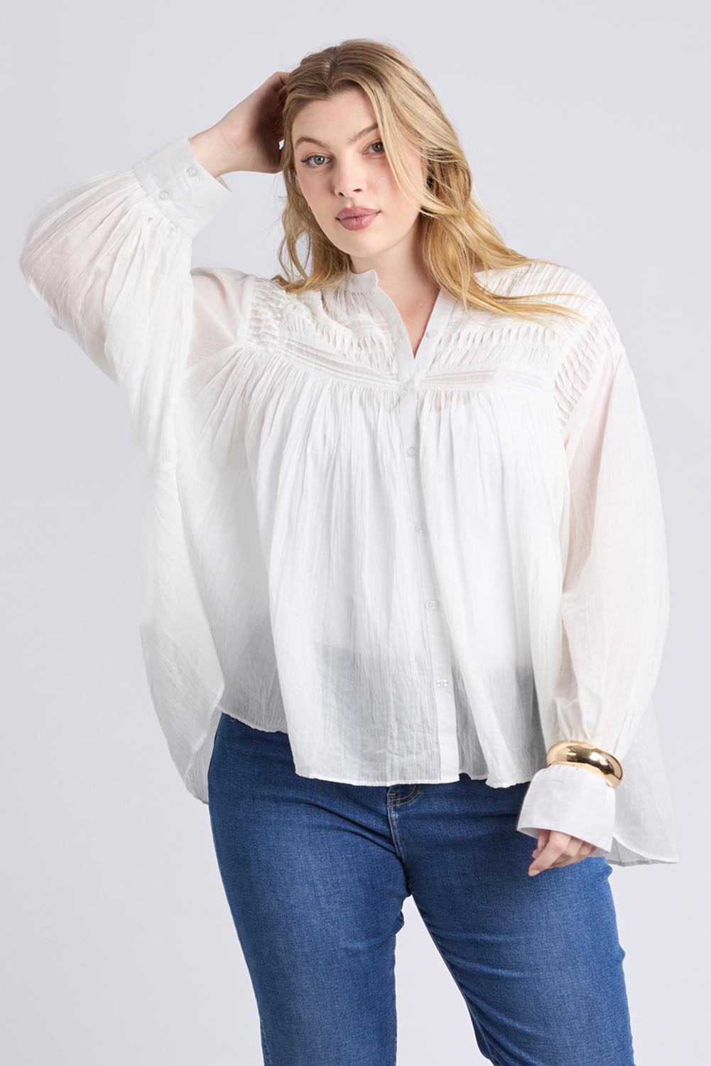 A model wearing the Montana Cotton Blouse in colour Marshmello (White), from the front, cropped image