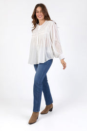 A model wearing the Montana Cotton Blouse in colour Marshmello (White), from the front, showing the whole outfit