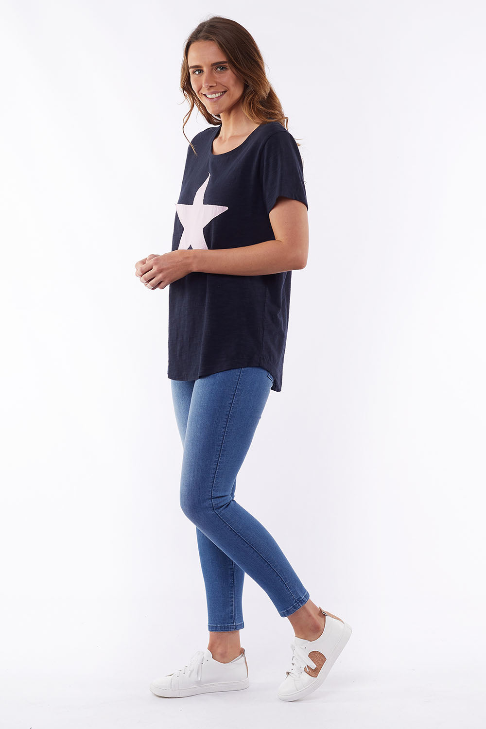 A model wearing the Starry Eyed Tee in colour Navy (Blue), from the front, showing the whole outfit