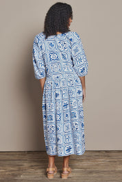 Model Ziara wearing size 10 of the Dolce Tile Cotton Blend Midi Dress in colour Oceantile (Blue), from the back