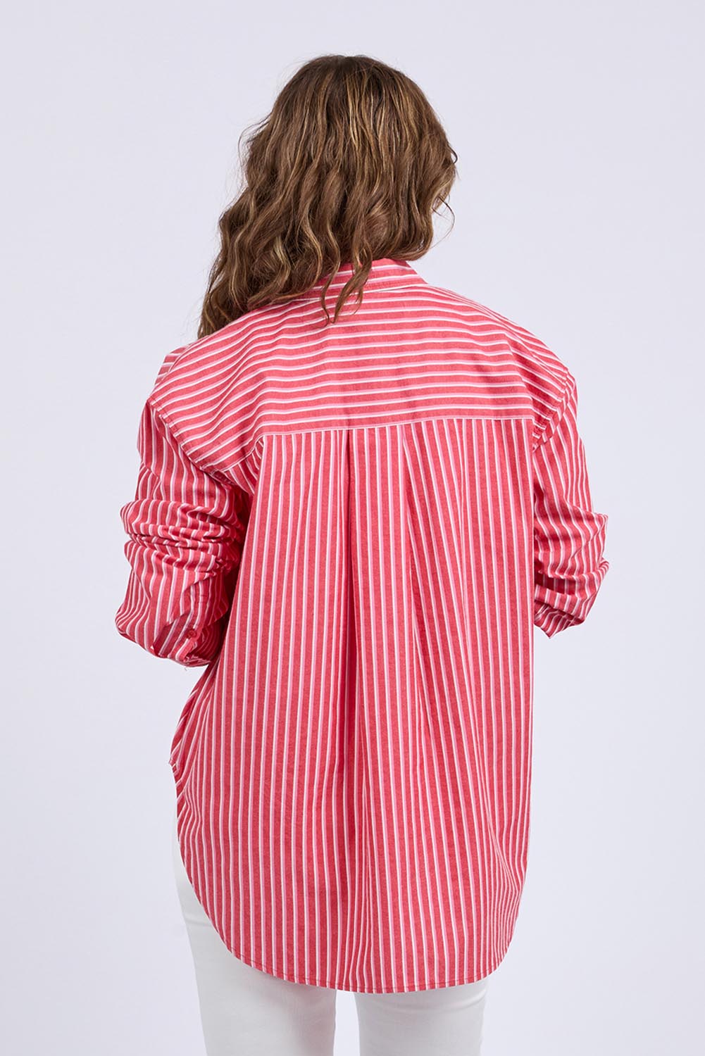 A model wearing the Frankie Striped Cotton Shirt in colour Cayenestri (Red), from the back