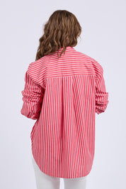 A model wearing the Frankie Striped Cotton Shirt in colour Cayenestri (Red), from the back