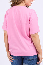 A model wearing the Camelia Cotton Tee in colour Chateauros (Pink), from the back