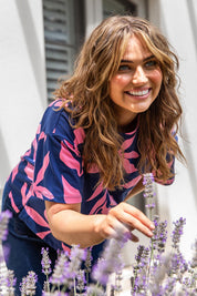 A model wearing the Mimosa Cotton Tee in colour Bluedepths, from the front, showing the whole outfit