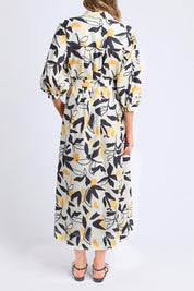 A model wearing the Limone Lyocell Linen Dress in colour Limone, from the back