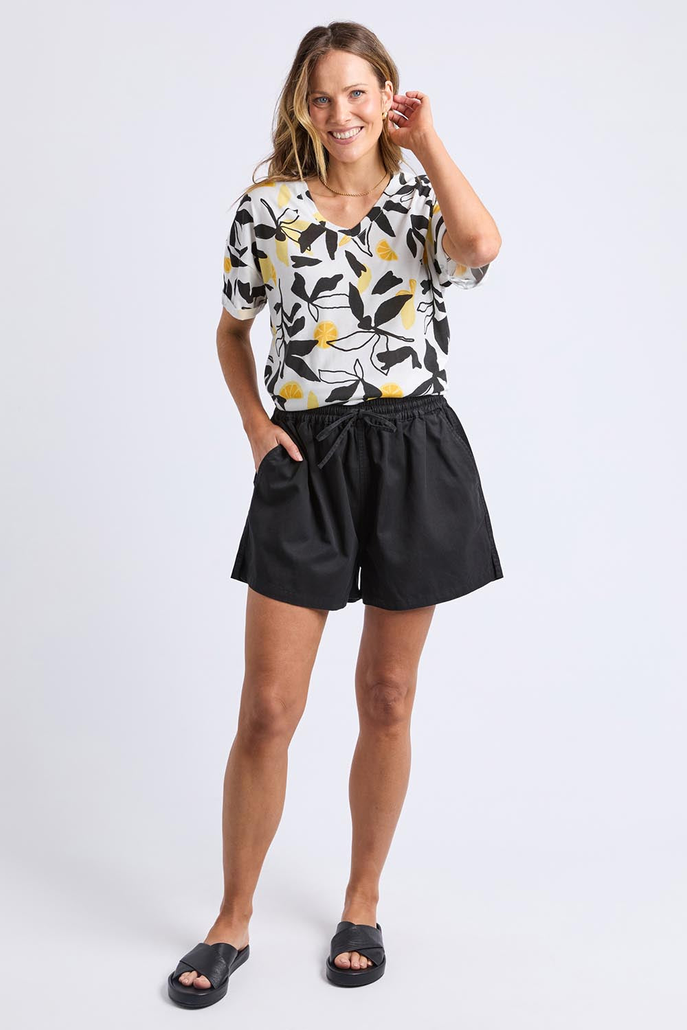 A model wearing the Lucinda Lyocell Cotton Short in colour Black (Black), from the front, showing the whole outfit