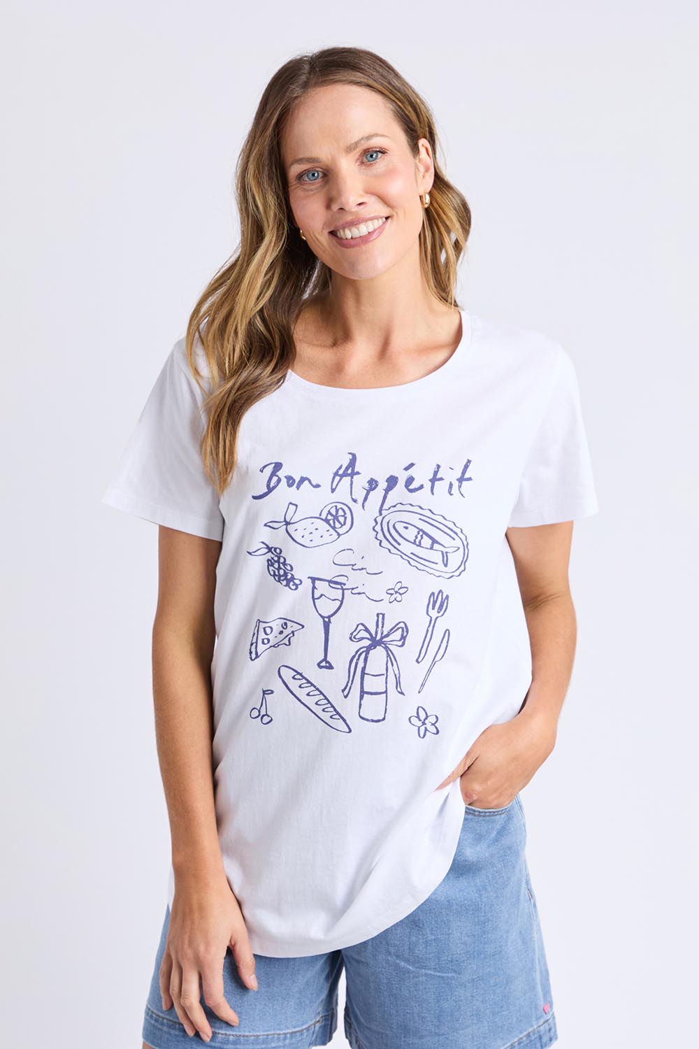 A model wearing the Bon Appetit Cotton Tee in colour White (White), from the front, cropped image